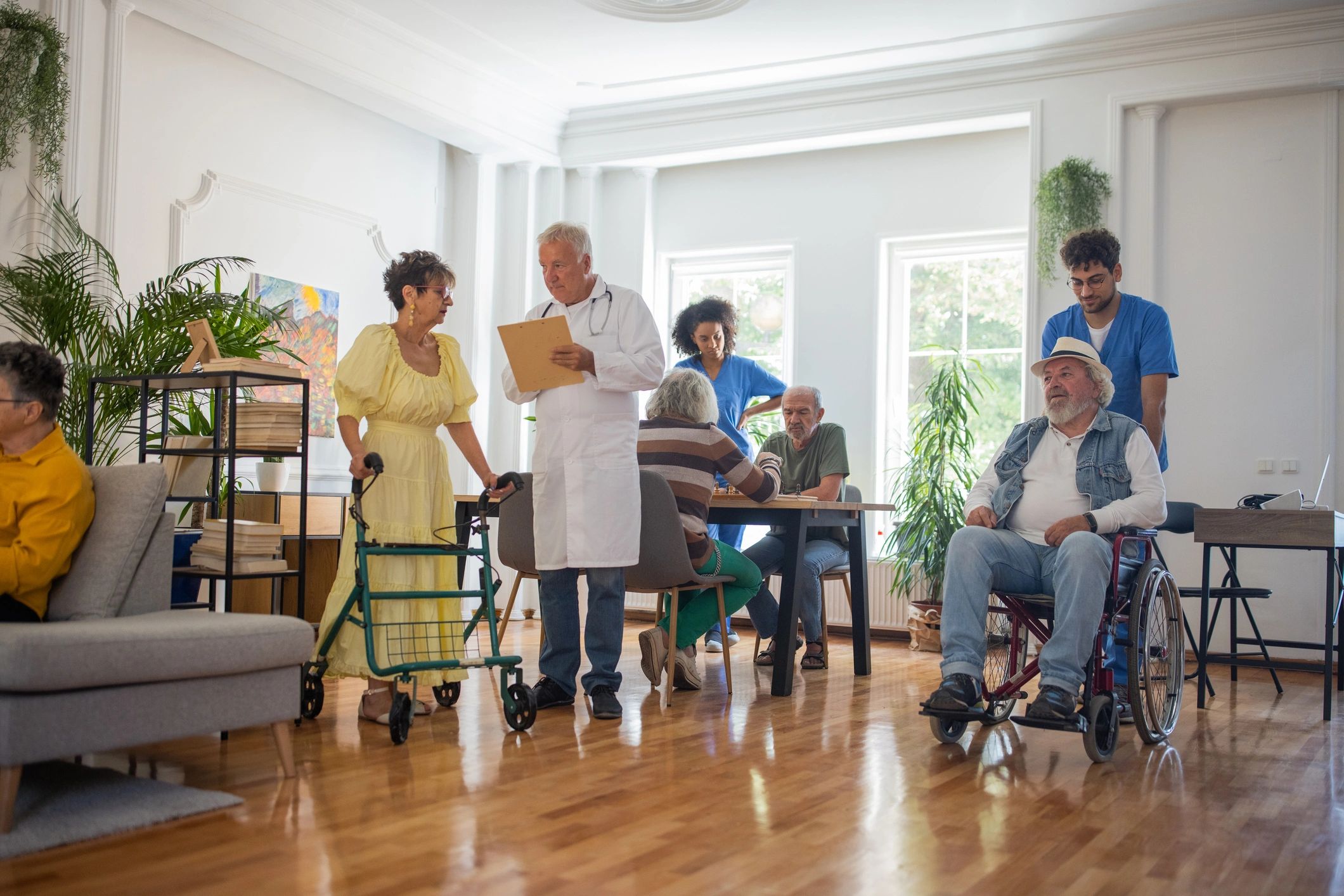 Healthcare workers supporting seniors in a nursing home