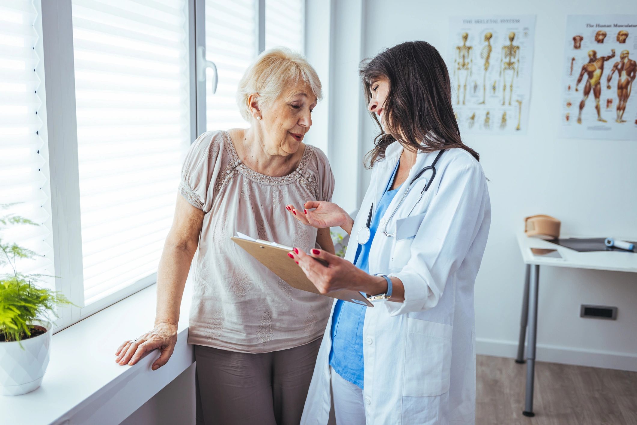 Healthcare professional discussing care and recovery plan with patient